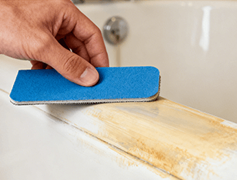 Cleaning and sanding a worn bathtub surface before applying DWIL 2K epoxy coating