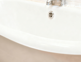 Glossy white bathtub finish drying and curing after DWIL 2K epoxy application