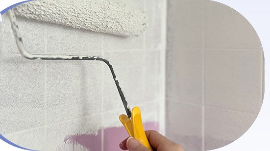 Applying DWIL Tub and Tile Paint evenly with a roller