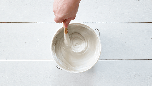 Stirring DWIL Wood Furniture Paint until the finish is even