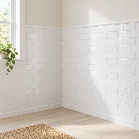 White ceramic tile walls in a bathroom corner